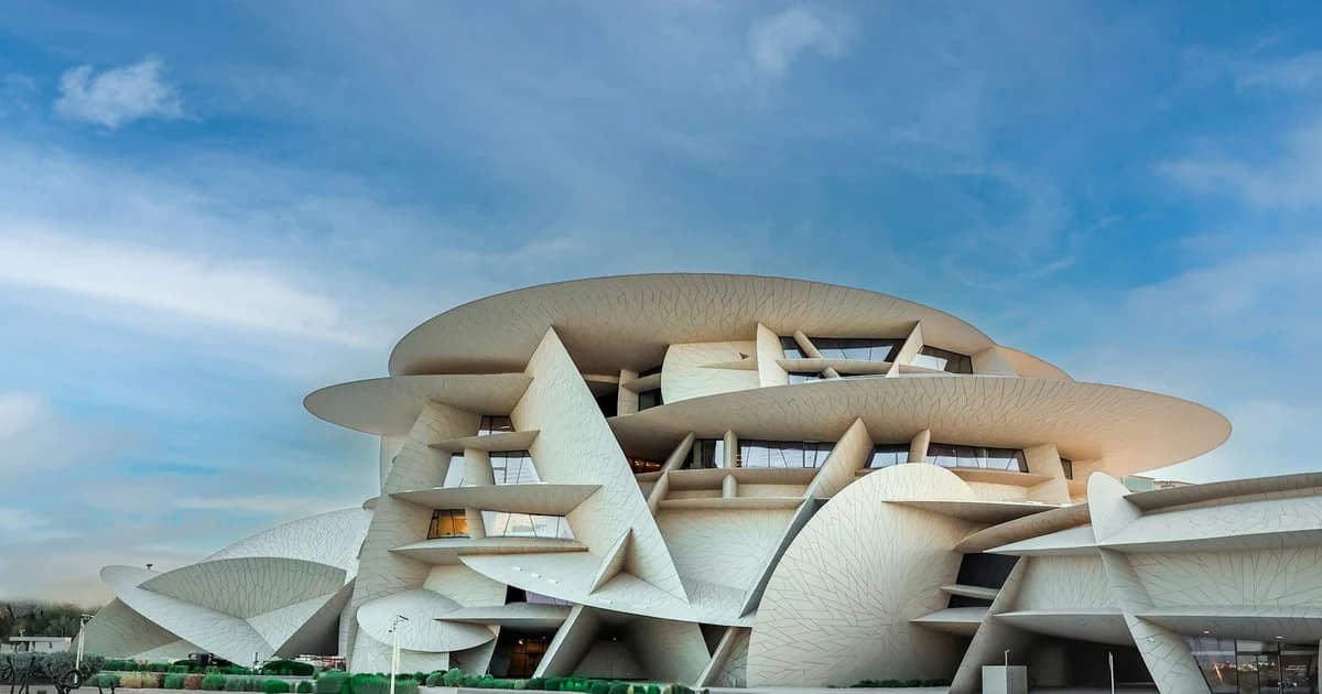 The National Museum of Qatar's desert rose building by Jean Nouvel beside its lagoon in Doha